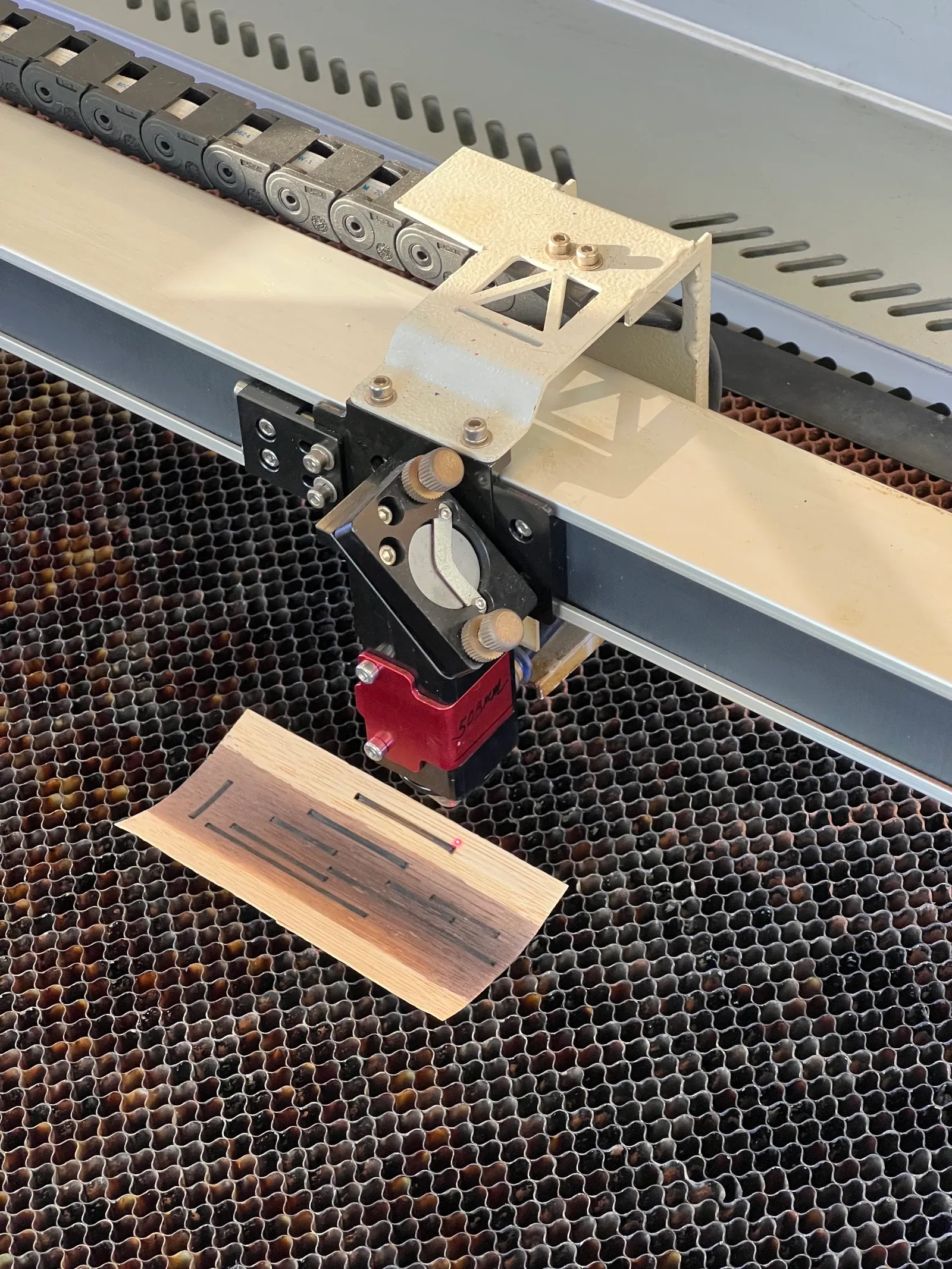 Original wood sample during laser processing