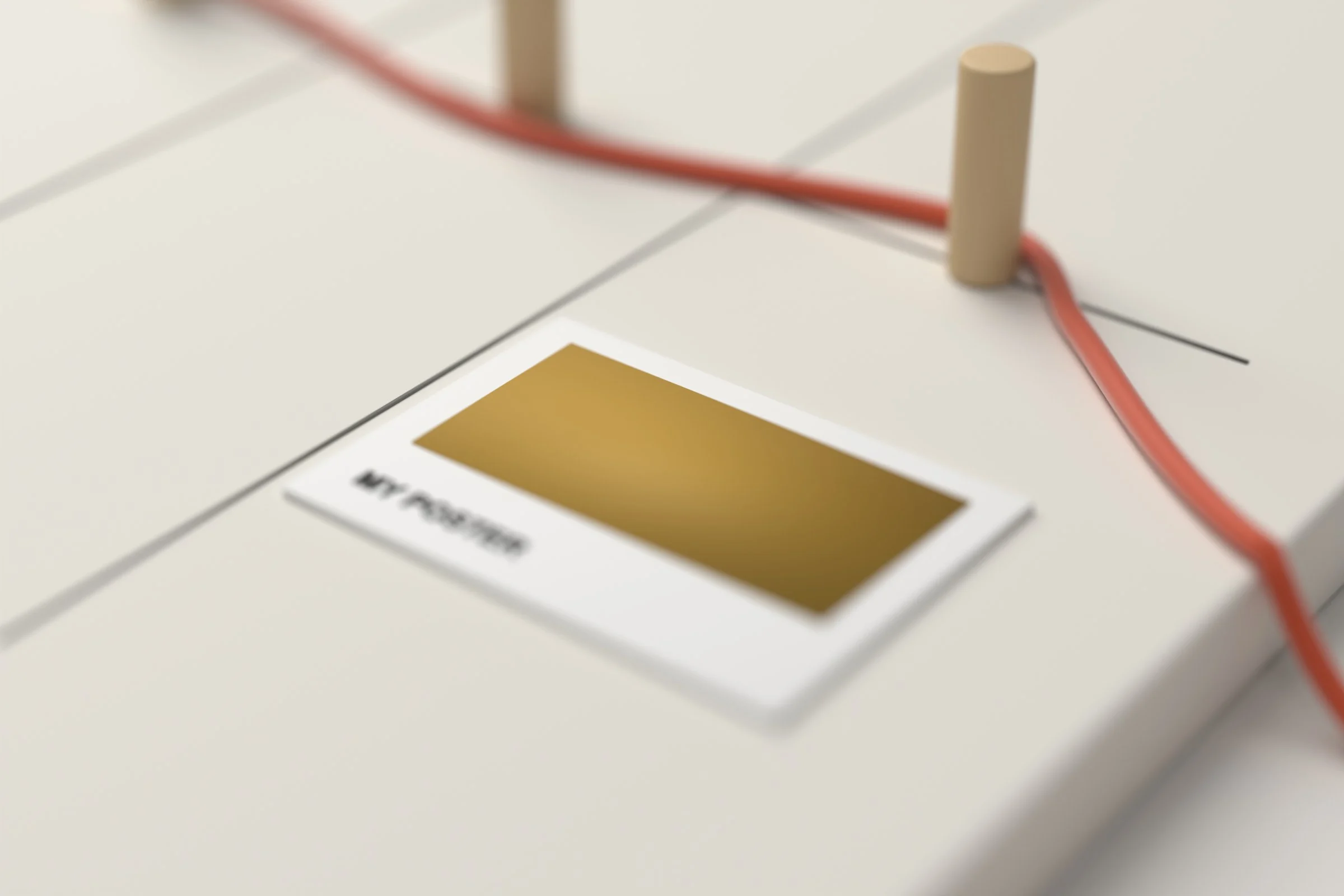 Close-up of the cord laced round a wooden peg and running off the board’s edge beside a card labelled My poster