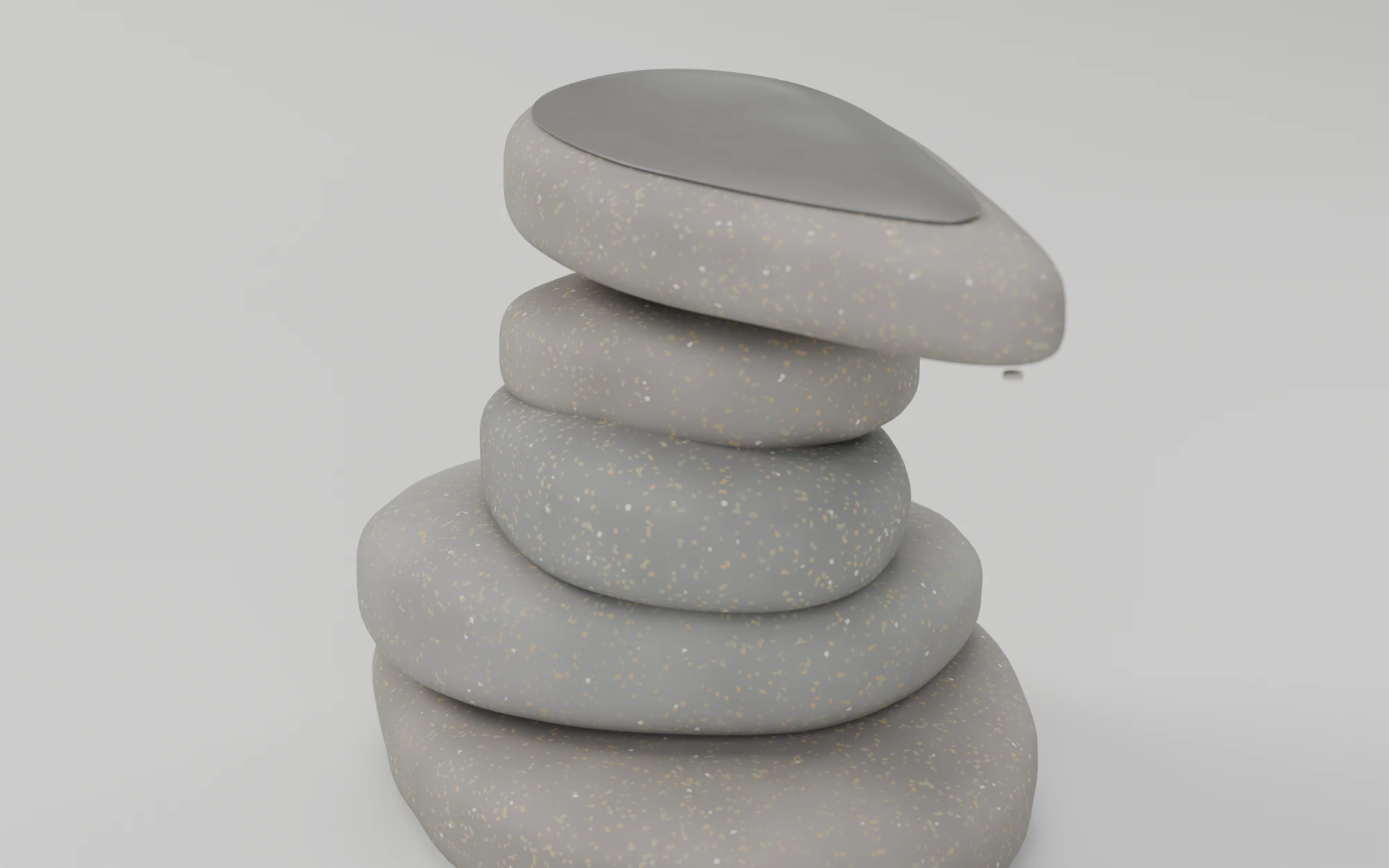 A knee-high cairn of four flat grey stones with a larger pointed top stone floating just above them; its crown is a darker grey solar panel, in daylight
