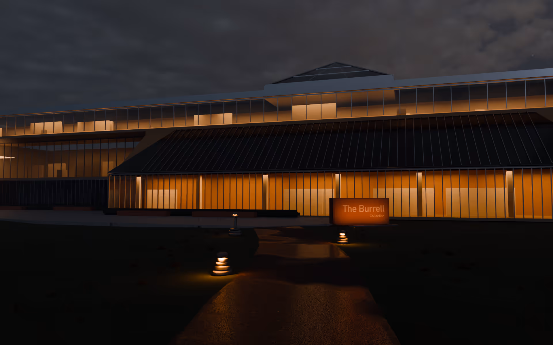 The Burrell Collection at dusk seen across its lawn: the long lit glass front under its sloping roof, the red sandstone sign by the forecourt, and low stacked-stone sub cairns, still dark, beside the path