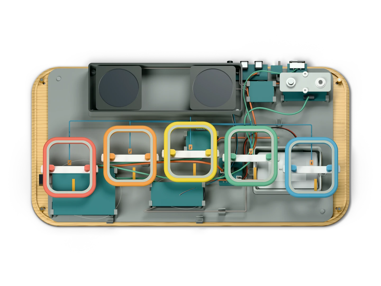 The same view with the shell and keys lifted off: coloured key frames over the service tray, the Arduino UNO, VS1053 and MPR121 boards, an amplifier and two speakers, joined by thin leads